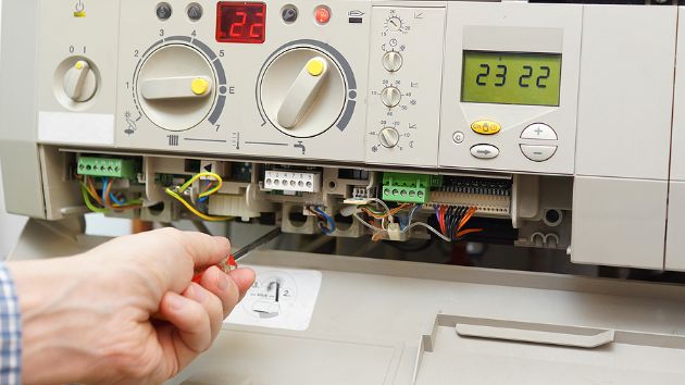 Technician repairing a furnace